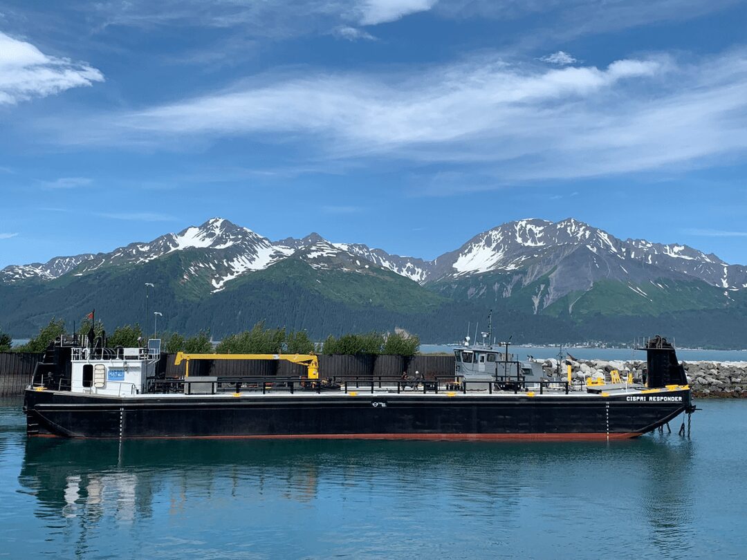 Boat near snow-capped mountains