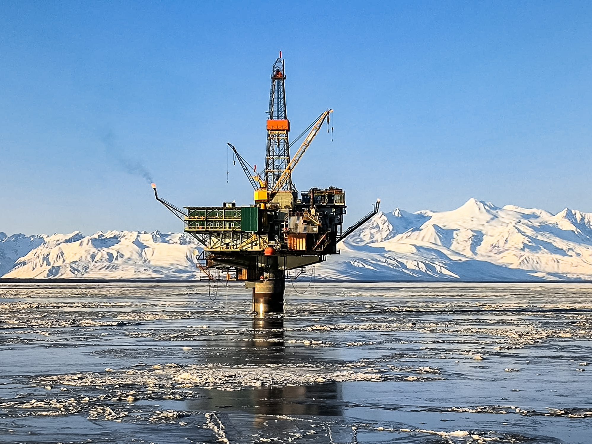 Arctic drilling platform under clear blue sky