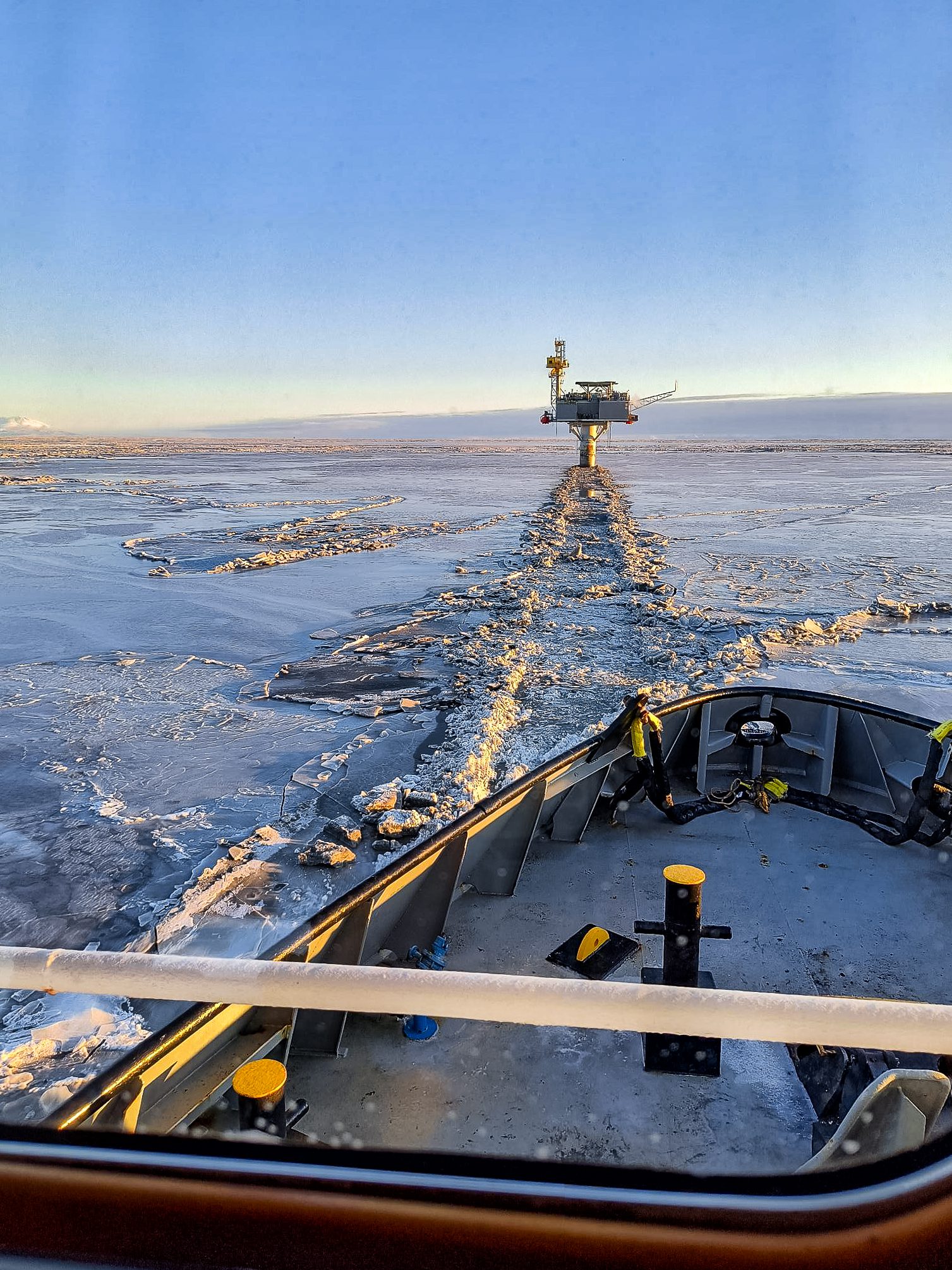 Ship breaking through icy waters