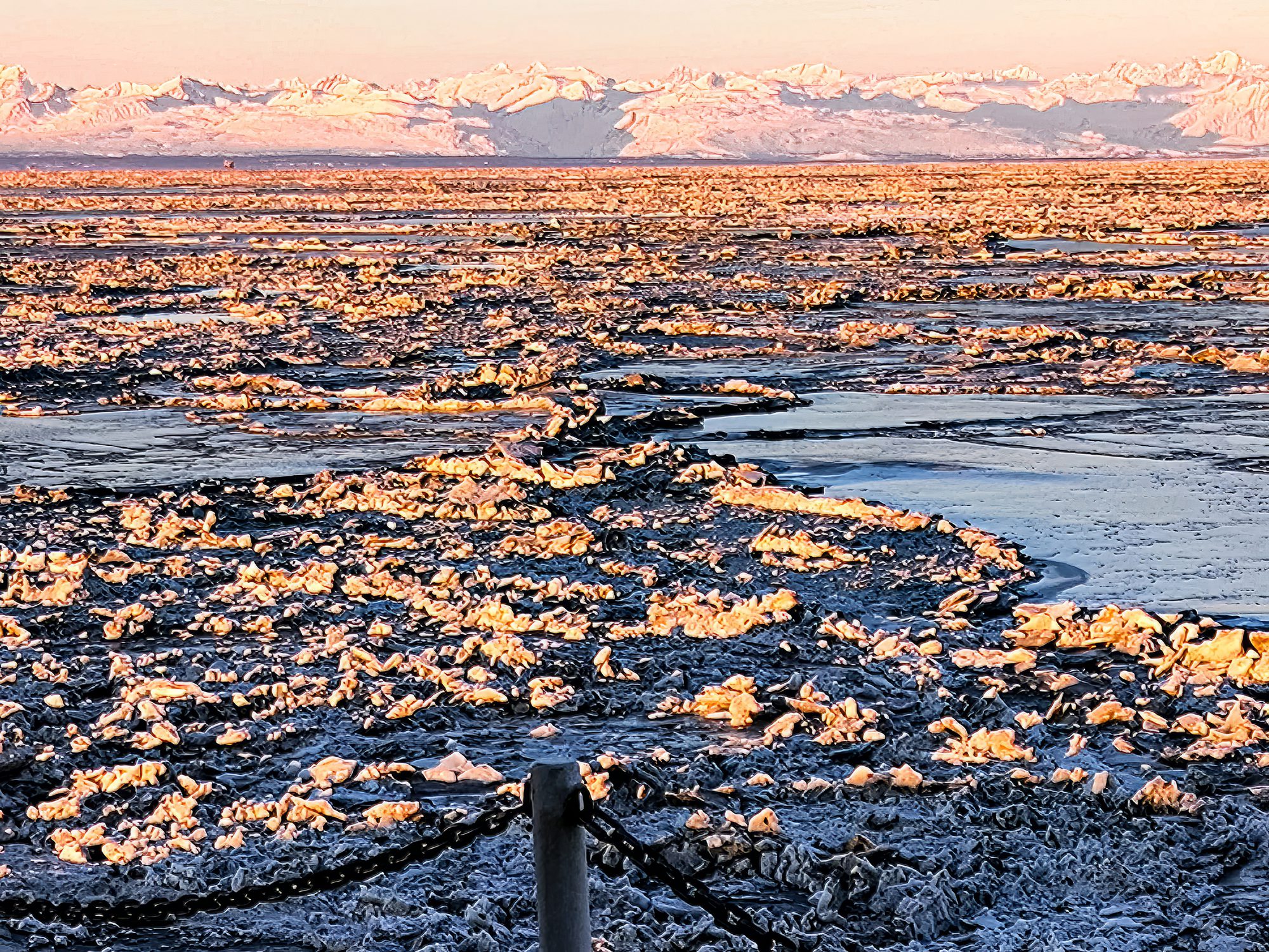 Sunrise over ice-covered ocean scene